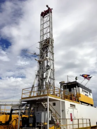 A large yellow and white tower with flags on top of it